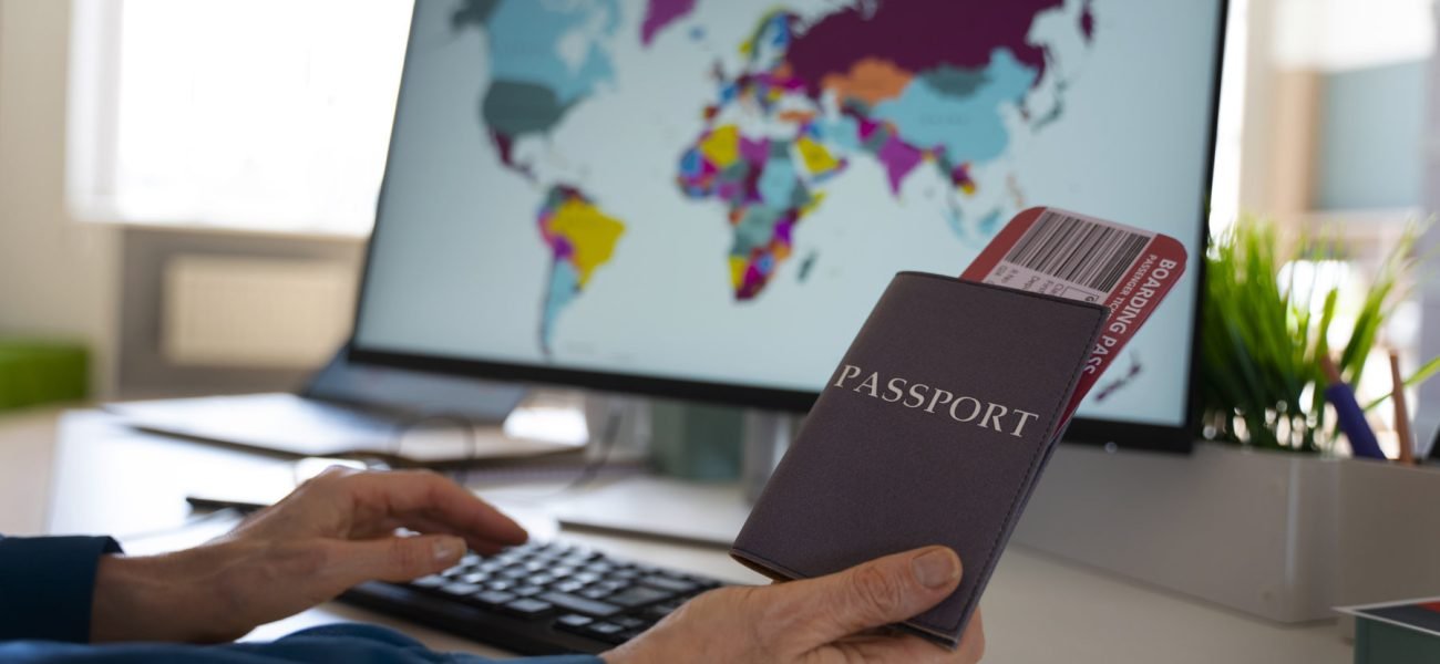 side-view-man-holding-passports 1